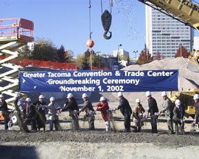 Officials engage in some ceremonial digging during last week's groundbreaking for Tacoma's new convention center. (PHOTO BY BRETT DAVIS)