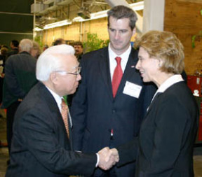 Evergreen Vice Group Chairman Capt. S. Y. Kuo (left) shakes hands with Washington Governor Christine Gregoire as Timothy J. Farrell, Executive Director of the Port of Tacoma (center) looks on.  Gov. Gregoire was in Tacoma for a ceremony to celebrate the opening of the Pierce County Terminal. (PHOTO BY TODD MATTHEWS)