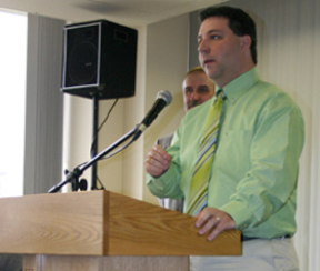 Tacoma small-business owner Marty Campbell receives honors during the New Tacoma Awards 2005 luncheon Friday.  The event, which recognized four achievers  for their ongoing roles in improving downtown, was sponsored by the Tacoma Pierce County Chamber of Commerce and Venture Bank. (PHOTO BY TODD MATTHEWS)