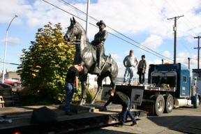 A monumental bronze statue of Theodore Roosevelt is loaded onto a flatbed trailer in preparation for a cross-country trek from Tacoma to Long Island, New York, and the tiny town of Oyster Bay, where Teddy Roosevelt was born. (PHOTO BY TODD MATTHEWS)