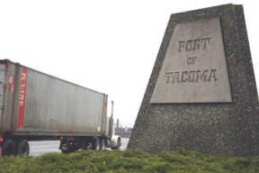 An intermodal container truck enters the Port of Tacoma near Pacific Highway and Port of Tacoma Road.  The port is exploring ways to make intermodal trucking a part of its overall operations and organizational priorities. (PHOTO BY TODD MATTHEWS)