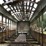 A late-morning gray light creeps through the arched and pockmarked roof of an old Turtleback streetcar that once operated in Tacoma. Today, it sits on a 40-acre field in Rockport, Wash., and is owned by Historic Railway Restoration. (PHOTO BY TODD MATTHEWS)