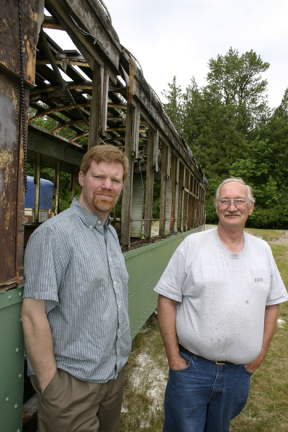 Vince and Tom Mendenhall, son-and-father owners of Arlington, Wash.-based Historic Railway Restoration, outside a 1908 Turtleback streetcar that once operated on Tacoma streets. (PHOTO BY TODD MATTHEWS)
