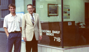 Tacoma native Marshall B. Skidmore, with his son Rob, in October of 1989, outside the Tacoma Daily Index's office on Pacific Avenue in downtown Tacoma.  Skidmore, who owned the city's legal newspaper for 37 years, passed away on July 23. (PHOTO COURTESY SKIDMORE FAMILY)