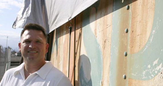 "The goal for me is just to have it restored," says Tacoma resident and historic rail enthusiast Dave Burns outside the 1910 dining car he owns. Last year, Burns moved the car from Easton, Wash., where it served as a roadside diner for 30 years, to the Tacoma tide flats. (PHOTO BY TODD MATTHEWS)