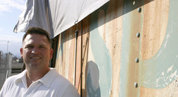 "The goal for me is just to have it restored," says Tacoma resident and historic rail enthusiast Dave Burns outside the 1910 dining car he owns. Last year, Burns moved the car from Easton, Wash., where it served as a roadside diner for 30 years, to the Tacoma tide flats. (PHOTO BY TODD MATTHEWS)