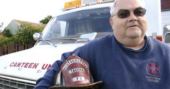 Tacoma resident Ralph Decker is one of several Fire Buffs who supports firefighters at emergency scenes. Decker and his wife, Michelle, serve food and water to firefighters and fire victims out of a mobile canteen unit. Decker has a long connection to the Tacoma Fire Department. He has served as the official photographer since 1971, and co-wrote a history of the department. (PHOTO BY TODD MATTHEWS)