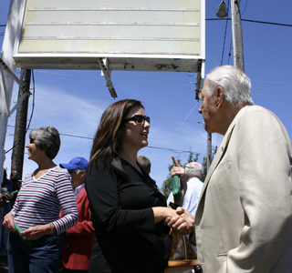 Christine Zemanek, executive director the Gary E. Milgard Family Foundation, and local developer Hugh S. Ferguson discuss Tacoma Goodwill's new job center during Wednesday's groundbreaking ceremony. (PHOTO BY TODD MATTHEWS)