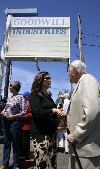 Christine Zemanek, executive director the Gary E. Milgard Family Foundation, and local developer Hugh S. Ferguson discuss Tacoma Goodwill's new job center during Wednesday's groundbreaking ceremony. (PHOTO BY TODD MATTHEWS)