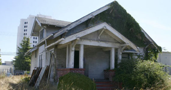 A sore sight for anyone's eyes, this 1916 Craftsman bungalow in Tacoma's Hilltop neighborhood is slated for demolition. Despite few incentives to recycle and reuse the building's materials, the owner-developer and a preservationist have collaborated to make sure some of the materials are recycled instead of sent to a landfill. (PHOTO BY TODD MATTHEWS)