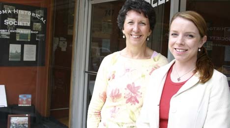 "If we are to save historic buildings, it's going to take energy and people who care," says Tacoma Historical Society (THS) volunteer Heather Straub (right). Straub and THS Director Mary Bowlby have opened an exhibit about downtown Tacoma's notable historic buildings. (PHOTO BY TODD MATTHEWS)