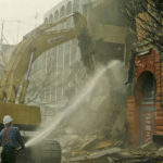 Fire hoses were used to keep down the dust that resulted from the demolition of old buildings along Pacific Avenue and near the Luzon Building during the 1980s. (COLUMBIA CORNERSTONE DEVELOPMENT COMPANY PHOTO COLLECTION 2008-7, COURTESY OF WEYERHAEUSER ARCHIVES)