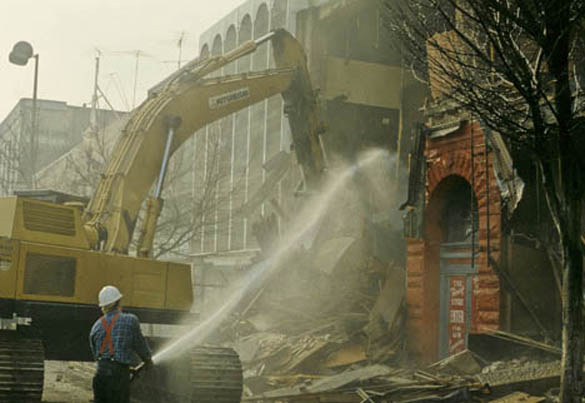 Fire hoses were used to keep down the dust that resulted from the demolition of old buildings along Pacific Avenue and near the Luzon Building during the 1980s. (COLUMBIA CORNERSTONE DEVELOPMENT COMPANY PHOTO COLLECTION 2008-7, COURTESY OF WEYERHAEUSER ARCHIVES)
