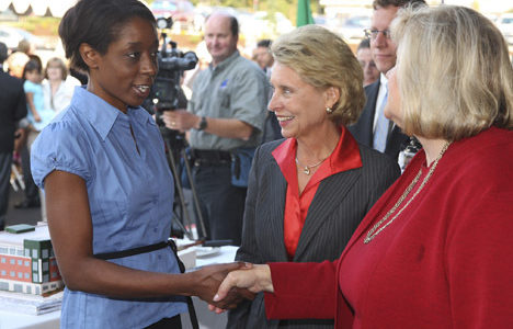 LaTasha Smith talks with Gov. Chris Gregoire and Tacoma Goodwill CEO Terry A. Hayes during Goodwill's dedication ceremony Wednesday of its new Milgard Work Opportunity Center. Smith, who graduated from Goodwill's financial literacy program, described the help she received as life changing. (PHOTO COURTESY TACOMA GOODWILL)