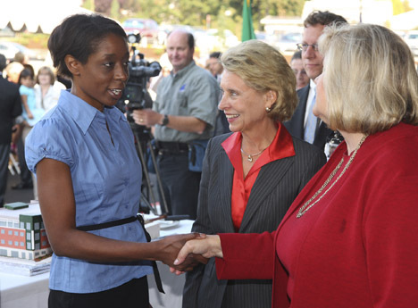 LaTasha Smith talks with Gov. Chris Gregoire and Tacoma Goodwill CEO Terry A. Hayes during Goodwill's dedication ceremony Wednesday of its new Milgard Work Opportunity Center. Smith, who graduated from Goodwill's financial literacy program, described the help she received as life changing. (PHOTO COURTESY TACOMA GOODWILL)