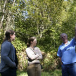 Graham resident and historian Lawrence D. "Andy" Anderson describes Kapowsin's early years to Chase and Johnson. (PHOTO BY TODD MATTHEWS)