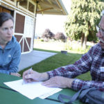 Johnson and Pierce County Landmarks and Historic Preservation Commissioner Bob Peters discuss historic sites in Orting. (PHOTO BY TODD MATTHEWS)