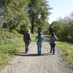 Peters, Johnson, and Chase walk along the Puyallup River searching for old flood drift barriers. (PHOTO BY TODD MATTHEWS)