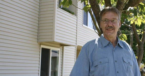 "That's a chapter in my life that I'm closing and I'm beginning a new one," says Glenn Grigsby, referring to the 15 years he spent living at the Winthrop Hotel in downtown Tacoma. He recently moved to HUD-subsidized housing in Tacoma's North End. "It's peaceful here. It's quiet. This is a new beginning for me." (PHOTO BY TODD MATTHEWS)