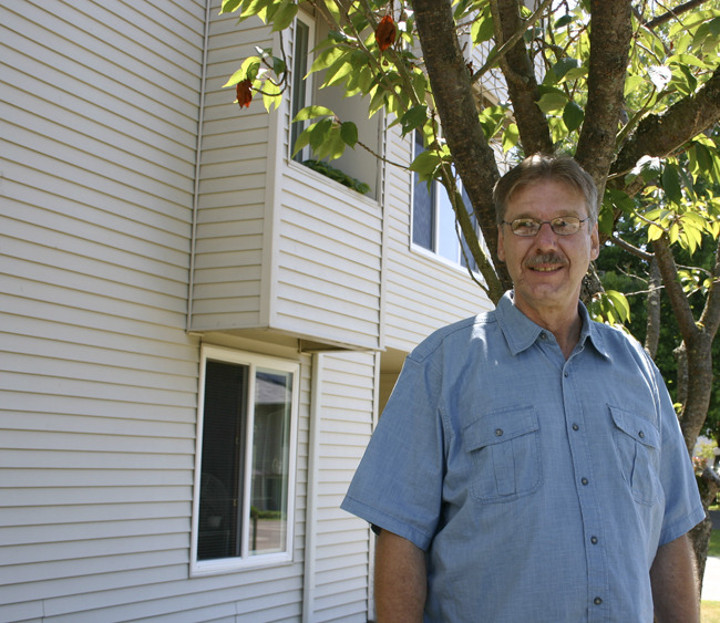 "That's a chapter in my life that I'm closing and I'm beginning a new one," says Glenn Grigsby, referring to the 15 years he spent living at the Winthrop Hotel in downtown Tacoma. He recently moved to HUD-subsidized housing in Tacoma's North End. "It's peaceful here. It's quiet. This is a new beginning for me." (PHOTO BY TODD MATTHEWS)