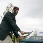 Tacoma political cartoonist R. R. Anderson marks the completion of the Sauro's parking lot downtown by holding a tongue-in-cheek ribbon-cutting ceremony. (PHOTO BY TODD MATTHEWS)