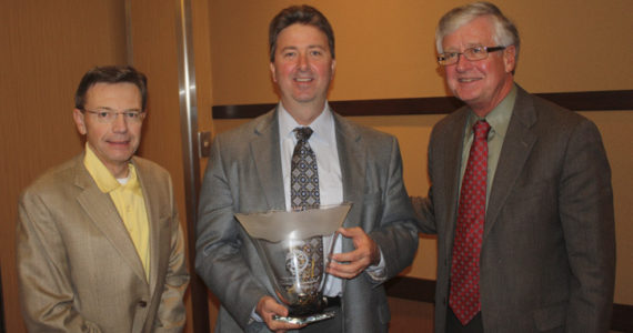 Steve Thomason (left) and Tom Taylor (right) of Taylor-Thomason Insurance presented the Tahoma Business Environmental Award to Eddie Westmoreland, Western Region VP of Government Affairs at Waste Connections. (PHOTO COURTESY TACOMA-PIERCE COUNTY CHAMBER)
