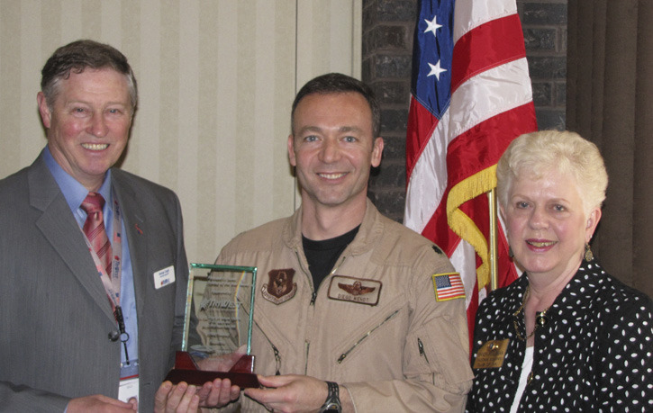 George Cargill of TriWest Healthcare Alliance (left) and Kiwanis Club President Sandy Roszman (right) presented the 2011 Howard O. Scott Citizen-Soldier of the Year Award to U.S. Air Force Reservist Lt. Col. Diego Wendt. (PHOTO COURTESY TACOMA-PIERCE COUNTY CHAMBER)