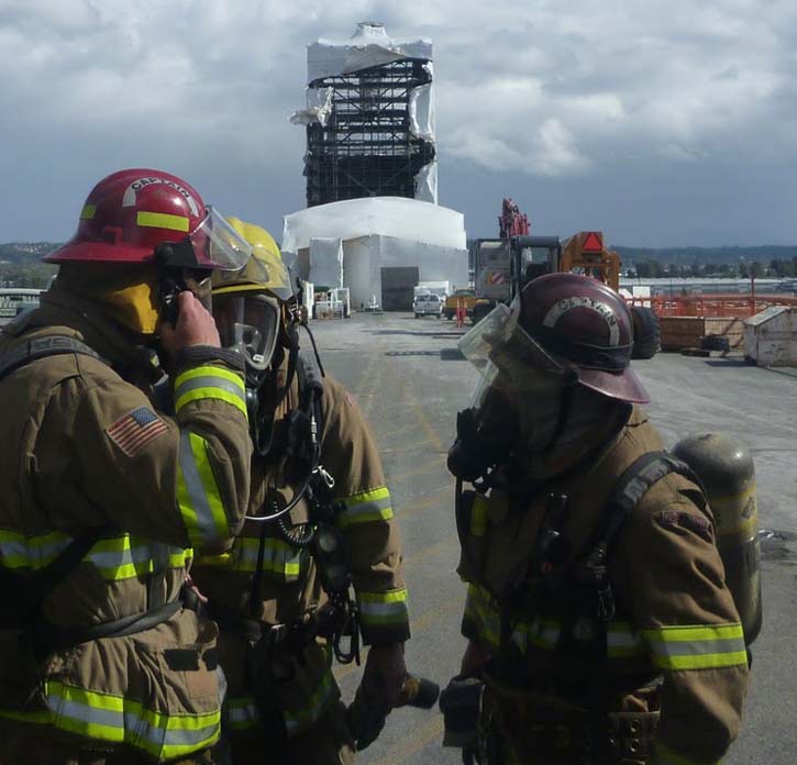 Tacoma firefighters responded Sunday at 11:45 a.m. to a report of hazardous condition on the Murray Morgan Bridge. First arriving firefighters found that the protective plastic sheathing surrounding one of the towers on the bridge had failed and a large volume of particulate matter was being blown from the scene. (PHOTO COURTESY TACOMA FIRE DEPARTMENT)