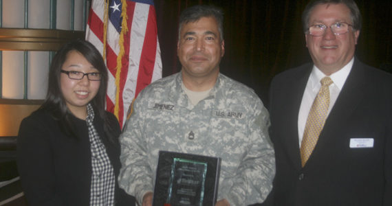 Sergeant First Class Luis Jimenez was awarded the John H. Anderson Military Citizen of the Year Award on Thursday. He was joined by his wife Sin Young Jimenez and Tri West Healthcare Alliance service director Rick Becker. (PHOTO COURTESY TACOMA-PIERCE COUNTY CHAMBER)