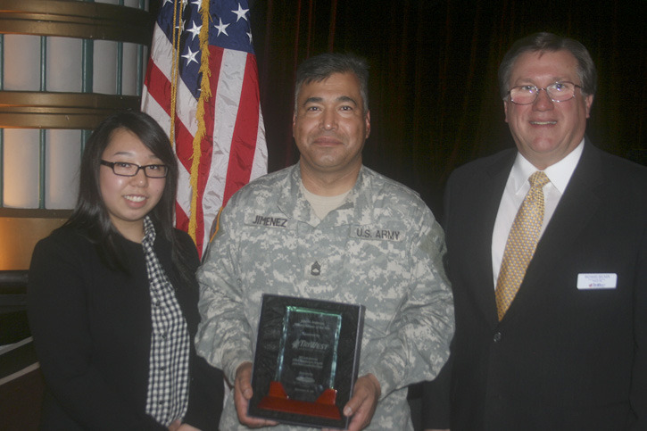 Sergeant First Class Luis Jimenez was awarded the John H. Anderson Military Citizen of the Year Award on Thursday. He was joined by his wife Sin Young Jimenez and Tri West Healthcare Alliance service director Rick Becker. (PHOTO COURTESY TACOMA-PIERCE COUNTY CHAMBER)