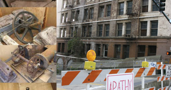 Bricks, an elevator fly wheel, a fire hose reel, and an elevator operator controller are some of the 450 artifacts left over after the 1891 Luzon Building in downtown Tacoma was demolished in 2009. (ARTIFACT PHOTOS COURTESY CITY OF TACOMA / LUZON BUILDING FILE PHOTO BY TODD MATTHEWS)