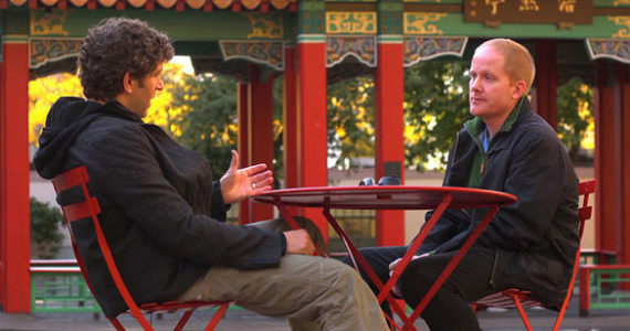 Chicago crime novelist Marcus Sakey (left) discusses the Wah Mee Club with Tacoma Daily Index editor Todd Matthews in Seattle's Hing Hay Park during an episode of Travel Channel's 'Hidden City' television program. (PHOTO COURTESY TRAVEL CHANNEL / HIDDEN CITY)