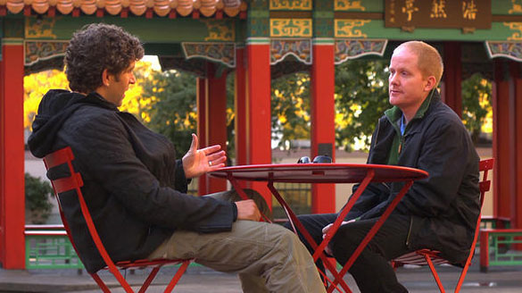Chicago crime novelist Marcus Sakey (left) discusses the Wah Mee Club with Tacoma Daily Index editor Todd Matthews in Seattle's Hing Hay Park during an episode of Travel Channel's 'Hidden City' television program. (PHOTO COURTESY TRAVEL CHANNEL / HIDDEN CITY)