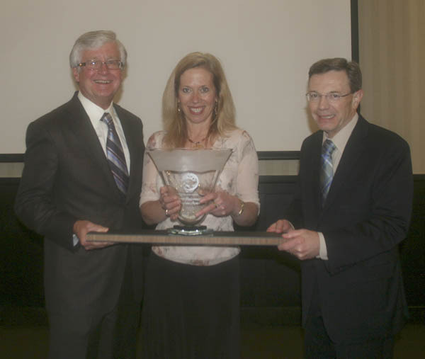 Tom Taylor (left) and Steve Thomason (right) of Taylor-Thomason Insurance Brokers present the Tacoma-Pierce County Chamber's Tahoma Environmental Award to Elaine Ott (center) of Richlite Company. (PHOTO COURTESY TACOMA-PIERCE COUNTY CHAMBER)