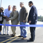 Representatives from the City of Tacoma and the Port of Tacoma celebrated the official re-opening of the Hylebos Bridge during a ribbon-cutting ceremony Wednesday. The bridge was out of commission for more than a decade before funding from the City of Tacoma, the Federal Highway Administration, and the Port of Tacoma paid for repairs. The Hylebos Bridge, which spans the Hylebos Waterway on East 11th Street, is an important transportation corridor for truck drivers hauling cargo throughout the tide flats and Northeast Tacoma residents headed toward State Route 509. (PHOTO BY TODD MATTHEWS)