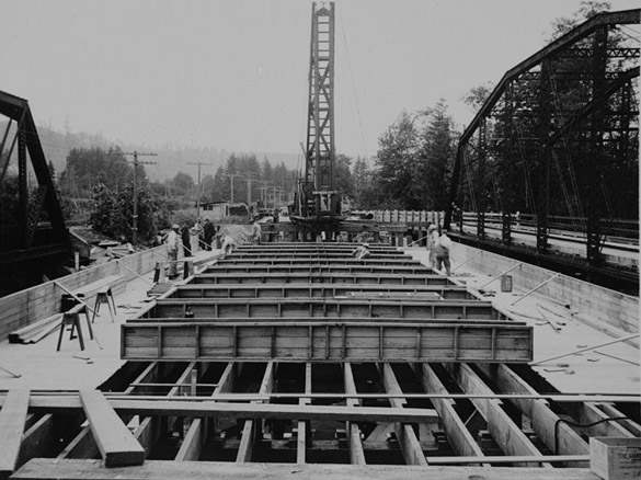 Workers began to build the new McMillin Bridge in September 1934, but had to pause mid-winter when the Puyallup River flooded. Construction resumed the following spring. By late summer, the new McMillin Bridge opened. The total cost was $35,912 and the bridge was cheap to maintain -- a selling point during the Great Depression. (PHOTOS COURTESY HISTORIC AMERICAN ENGINEERING RECORD / NATIONAL PARK SERVICE)