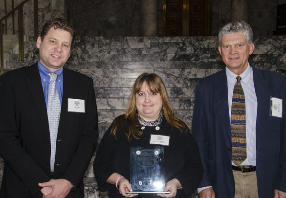 Keith Cotton (left), demand management programs manager for the Washington State Department of Transportation, and Ted Horobiowski (right), Commute Trip Reduction board vice chair, presented the Governor's Commute Smart Award for Commute Smart Employer Leadership to University of Washington Tacoma employee transportation coordinator Jennifer Burley. (PHOTO COURTESY WASHINGTON STATE DEPARTMENT OF TRANSPORTATION)