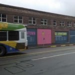 A Pierce Transit bus travels along Market Street and past a new artistic mural that aims to promote downtown Tacoma. (PHOTO COURTESY DOWNTOWN ON THE GO)