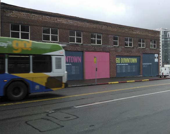 A Pierce Transit bus travels along Market Street and past a new artistic mural that aims to promote downtown Tacoma. (PHOTO COURTESY DOWNTOWN ON THE GO)