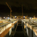 The gate of the casting basin was removed early Monday morning at the Concrete Tech Corporation site in Tacoma. Once the gate was pulled, high tide filled the basin, allowing crews to move in with tug boats to tow them out into the open water. (PHOTO COURTESY WASHINGTON STATE DEPARTMENT OF TRANSPORTATION)