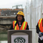 Tacoma Mayor Marilyn Strickland (center) speaks during the float-out event held on Monday at the Concrete Technology Corp. site in Tacoma. She was joined by Pierce County Executive Pat McCarthy (left) and Washington State Department of Transportation Secretary Paula Hammond (right). (PHOTO COURTESY WASHINGTON STATE DEPARTMENT OF TRANSPORTATION)