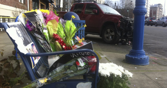 Friends and family members left flowers, cards, and personal messages on a public bench near the site of a deadly crash early Sunday morning in Tacoma. (PHOTO BY TODD MATTHEWS)