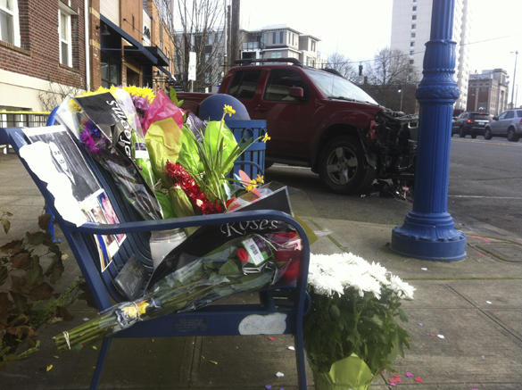 Friends and family members left flowers, cards, and personal messages on a public bench near the site of a deadly crash early Sunday morning in Tacoma. (PHOTO BY TODD MATTHEWS)