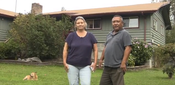 Ledena and Antonio Mendiola, Jr. stand in front of their flood-prone Tacoma home that was purchased last year by Pierce County as part of a flood buyout program. On Friday, the home was used for a Tacoma Police Department SWAT team training exercise before it will be ultimately demolished by county crews and returned to a natural floodplain. (PHOTO COURTESY PIERCE COUNTY)