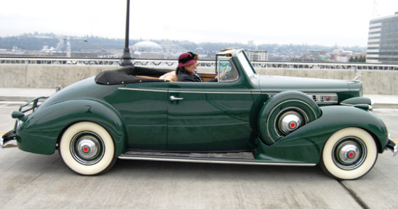 Tacoma Mayor Marilyn Strickland crosses the Murray Morgan Bridge Friday morning in a classic automobile. (PHOTO COURTESY CITY OF TACOMA)