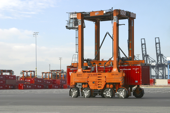 A straddle carrier moves a "K" Line cargo container at the Port of Tacoma's Husky Terminal. (PHOTO COURTESY PORT OF TACOMA)