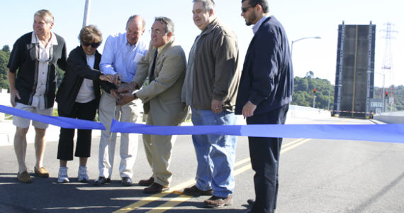 Last June, representatives from the City of Tacoma and the Port of Tacoma gathered on the west side of the Blair Waterway for a ribbon-cutting ceremony to celebrate the official re-opening of the Hylebos Bridge. (FILE PHOTO BY TODD MATTHEWS)