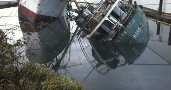 In January, the Helena Star sank in the Hylebos Waterway, dragging the 130-foot fishing vessel Golden West over to an extreme angle. (PHOTO COURTESY WASHINGTON STATE DEPARTMENT OF ECOLOGY)