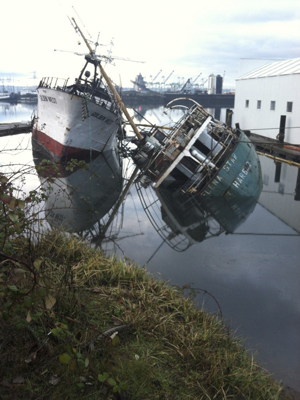 In January, the Helena Star sank in the Hylebos Waterway, dragging the 130-foot fishing vessel Golden West over to an extreme angle. (PHOTO COURTESY WASHINGTON STATE DEPARTMENT OF ECOLOGY)
