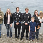 (from left to right) Tacoma fire fighter Jack Hawkins, John Bronson, Rebecca Thayer-Blunt, fire fighter Annie Craig, captain Jennifer Gunnel, and extended family at Owen Beach. (PHOTO COURTESY TACOMA FIRE DEPARTMENT)